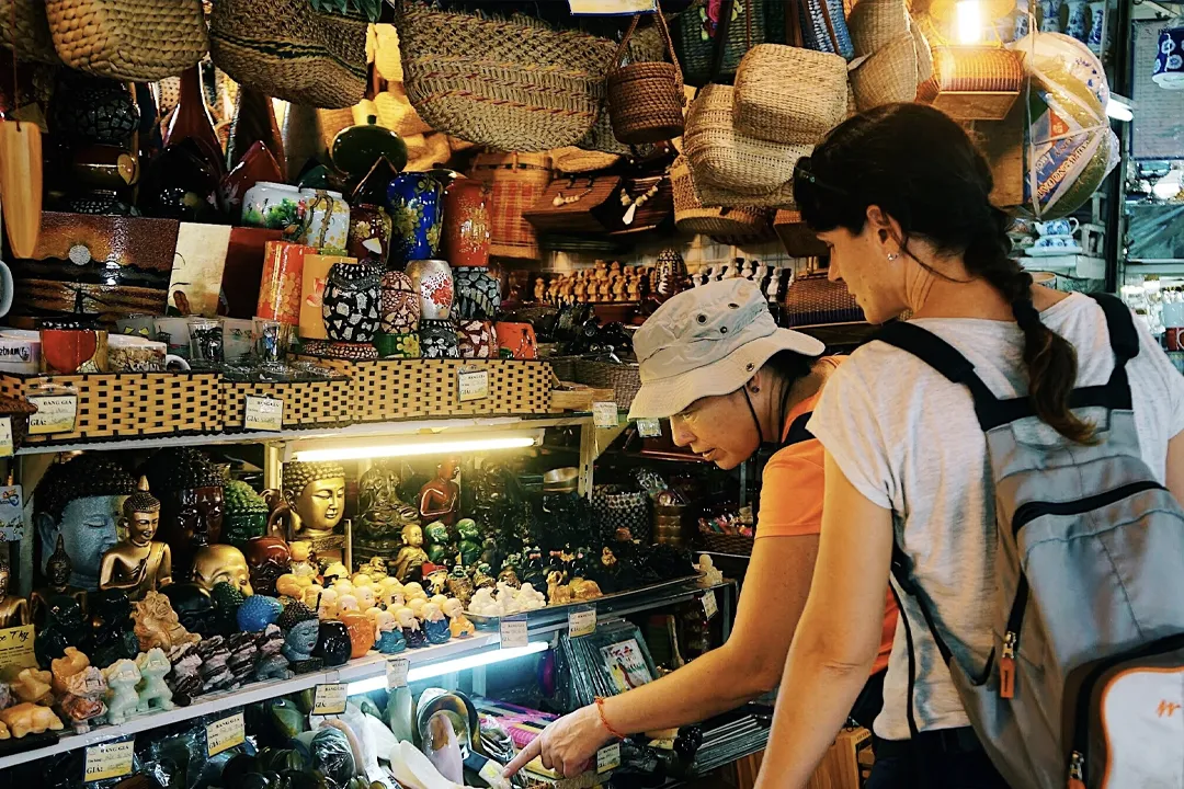 Customers buying goods at the market