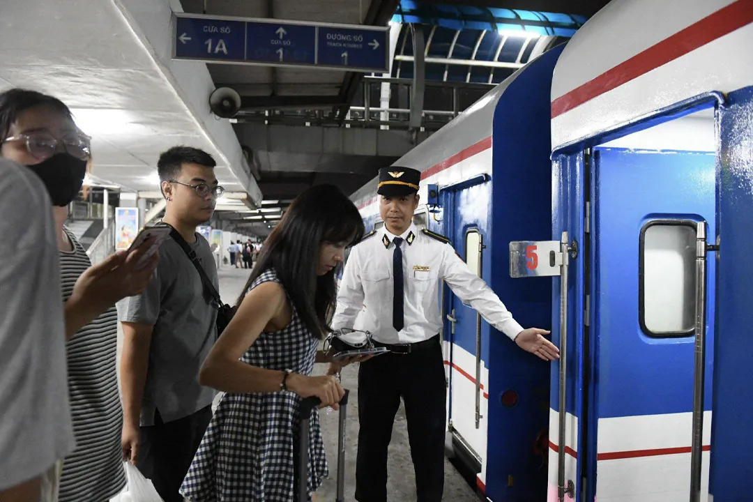Passengers board the train.
