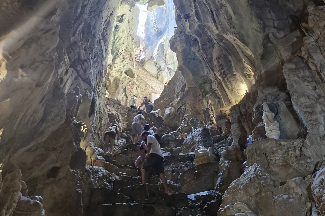 Am Phu Cave is the most challenging to explore. The name means “Hell Cave”, and it is deliberately dark and narrow