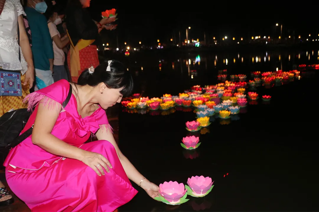 People release floating lanterns during the festival
