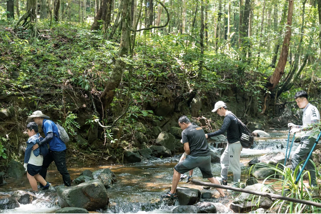 Tourists experience trekking activities.