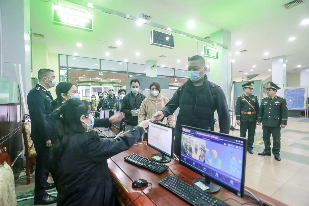 People traveling to China go through customs procedures at the Lao Cai border gate.
