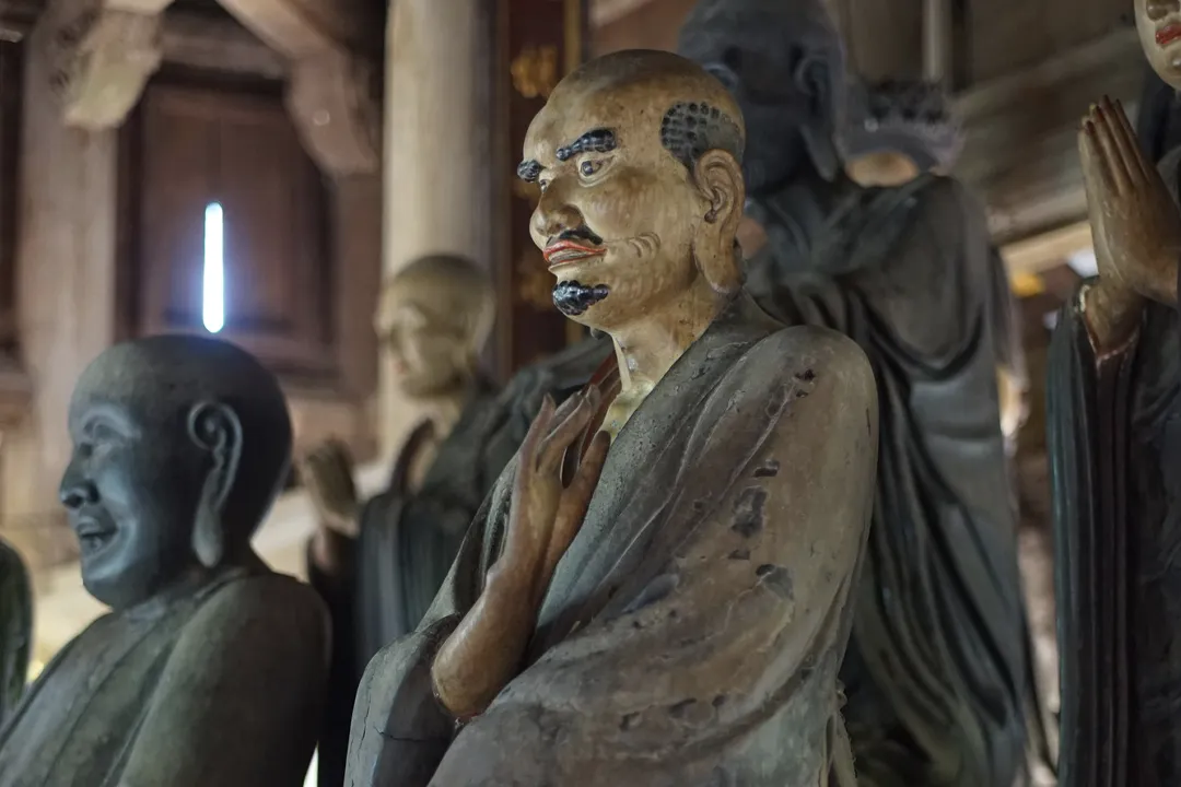 The Mahakasyapa statue, one of many Arhat statues at Tay Phuong Pagoda.
